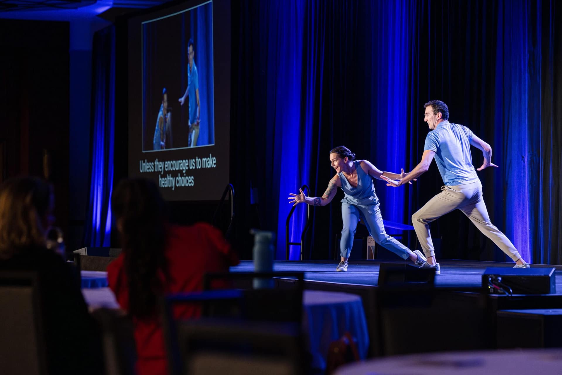 Two people perform a piece for the crowd.